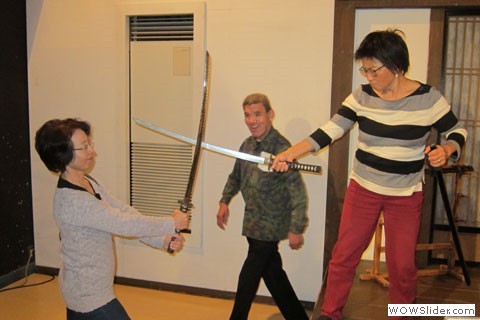 two women sword fight